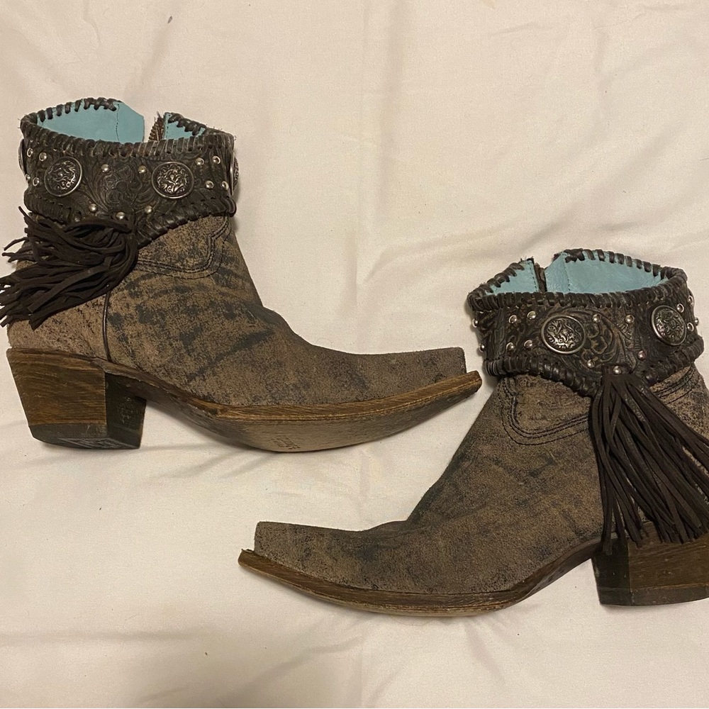Never worn Corral by Buckle bootie. Leather with fringe. Turquoise interior